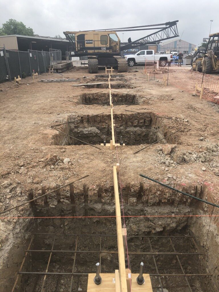 9 canopy footings being installed